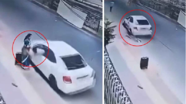 চলন্ত কারে নারীকে টেনে নিয়ে ভ্যানিটি ব্যাগ ছিনতাই