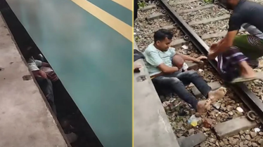 চলন্ত ট্রেন থেকে পড়ে যাওয়া ছেলেকে ঝাঁপ দিয়ে বাঁচালেন বাবা